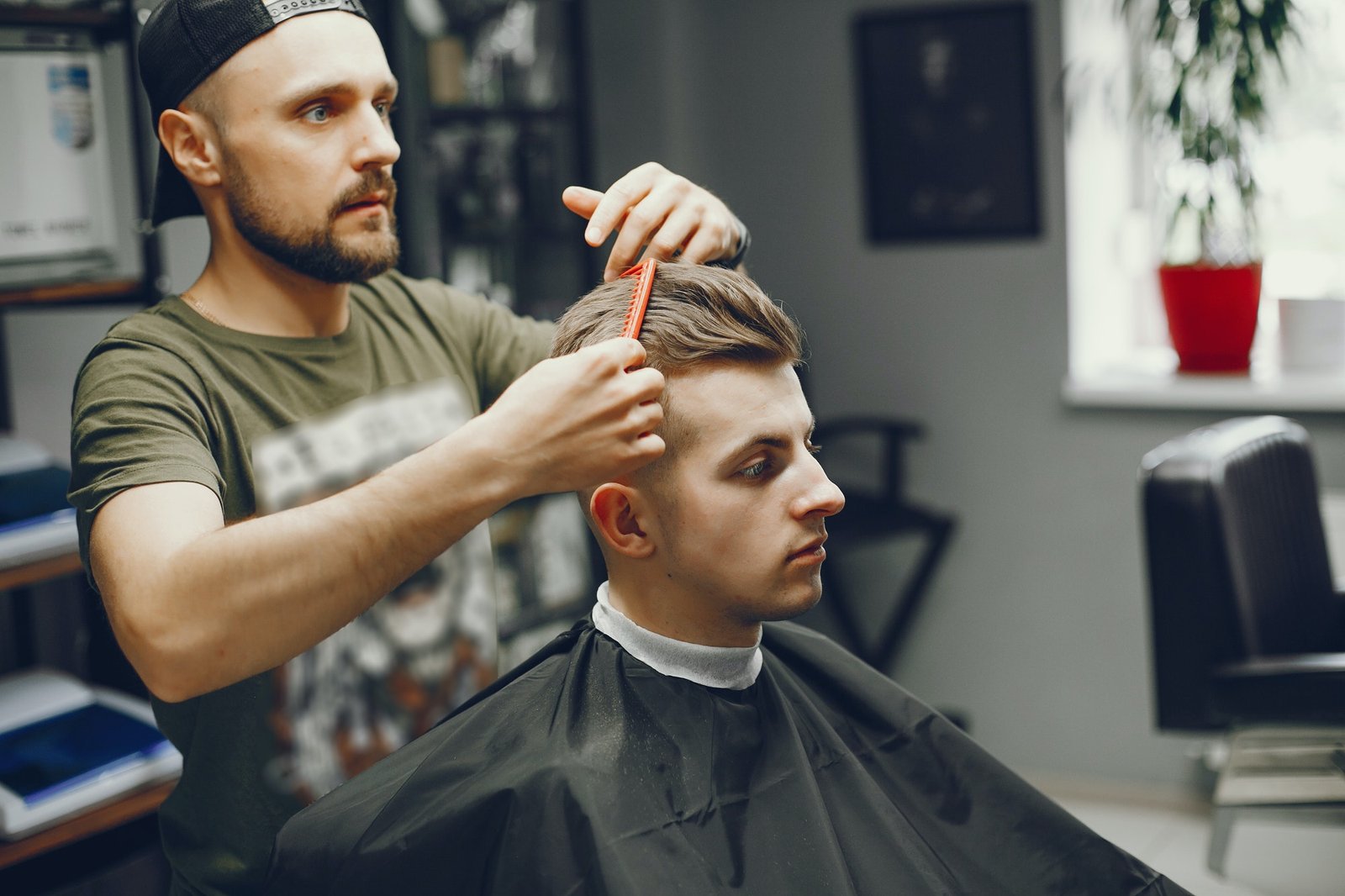 a-man-cuts-hair-in-a-barbershop.jpg a-man-cuts-hair-in-a-barbershop.jpg